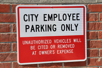 City Employee Parking Only sign outside municipal facilities