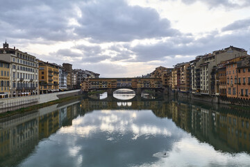 Fototapeta premium Ponte Vecchio Bridge under Dramatic Sky and Clouds in Florence Italy
