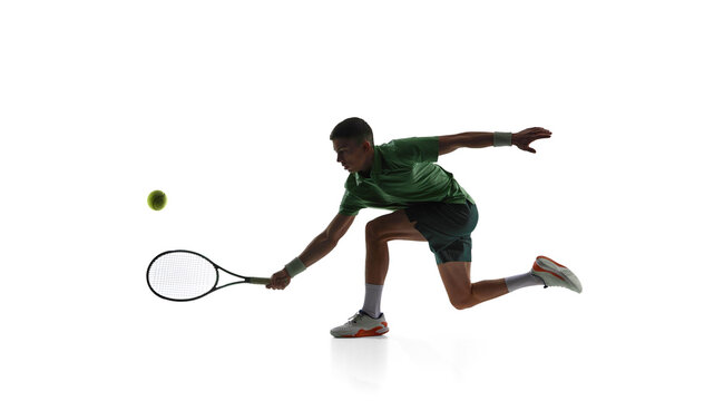 Tennis player low forehand reach isolated on white background. Concept of defensive play training, low ball technique drills, footwork practice, tennis coaching materials.