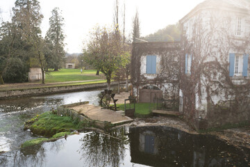 Obraz premium Buildings small vineyard on the Dronne River, Brantome, Brantome-en-Perigord, France