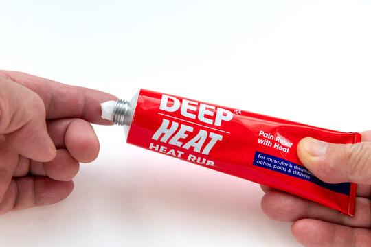 London. UK- January 25. 2026. A close up of a person squeezing a tube of Deep Heat pain relief heat rub onto a finger.