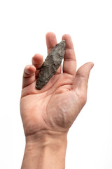 Obraz premium Stone Age Flint Spear | Perfectly Preserved Prehistoric Biface Artifact. pov camera. my hand. white background