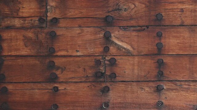 Construction of a wooden ship. Shipyard of traditional Dhow wooden boat on Iranian Qeshm Island. Board of Tradition Lenz Fishing Boat in Southern Iran. Old wooden stealth smuggler's ship.