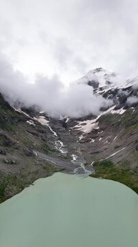 Bird's-eye view of the Triftsee Glacier with turquoise waters and the top of the mountains at Bern, Switzerland