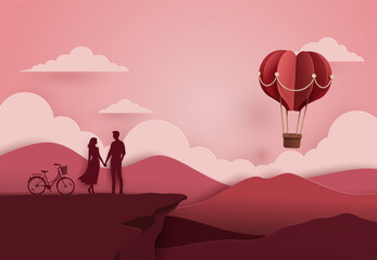 Paper art style vector illustration of a romantic couple holding hands on a cliff with a bicycle and red heart balloon, Valentine's day concept.
