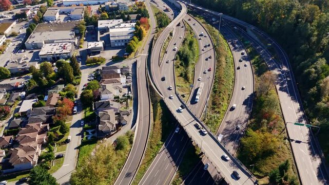 Cars Driving On The Highways On A Sunny Day In BC, Canada. - aerial shot