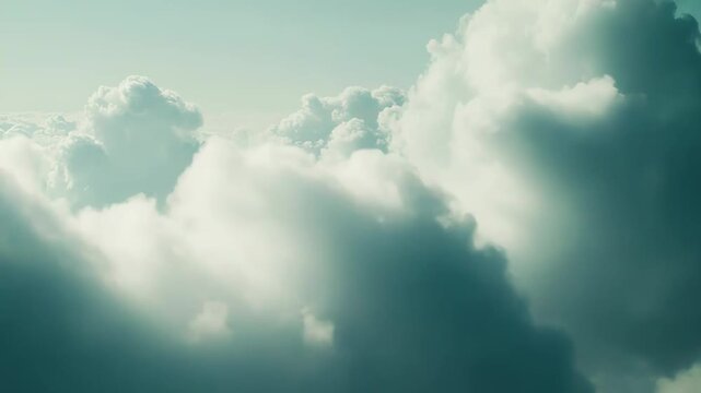 Fluffy white clouds populate the serene blue green sky, creating a peaceful and expansive natural backdrop suitable for themes of freedom, flight, atmosphere, and heavenly dreams