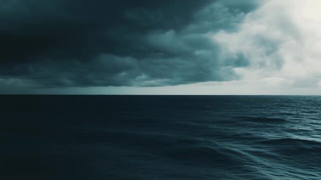 Choppy ocean waves reflect the dramatic, dark and powerful storm clouds, creating a foreboding atmosphere and symbolizing challenges, uncertainty, danger, and the raw force of nature