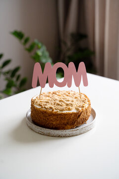 Happy mothers day concept with celebrate homemade cake with mom text