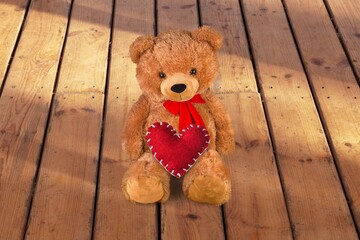 Naklejka premium Teddy Bear hold red heart, love concept