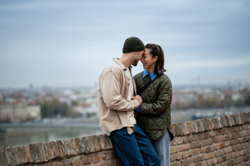 Fototapeta premium Interracial couple sharing an intimate moment outdoors