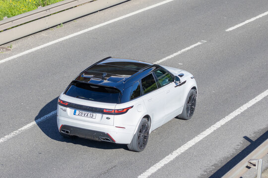 White range rover velar driving on highway enjoying transport