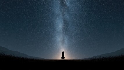 Fototapeta premium A silhouette of a rocket under a starry sky, with the Milky Way glowing above, set against a serene, dark landscape.