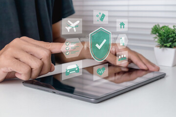 Insurance protection concept. A man looking for information about insurance on a tablet.