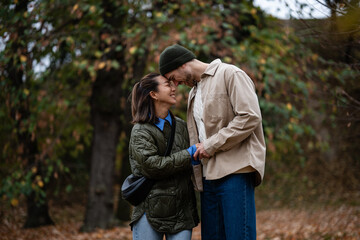 Fototapeta premium Happy loving couple enjoying autumn day outdoors