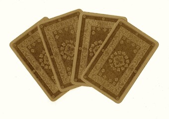A hand of vintage playing cards showing four of the same value isolated on a white background.