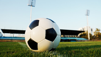Soccer ball on the sidelines of an outdoor arena, representing game day and professional sports