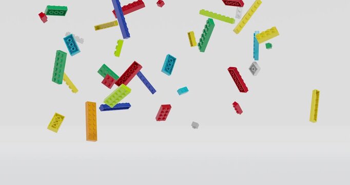 Toy plastic building bricks falling and rotating in slow motion footage with grey background. 3D 4K FX animation.
