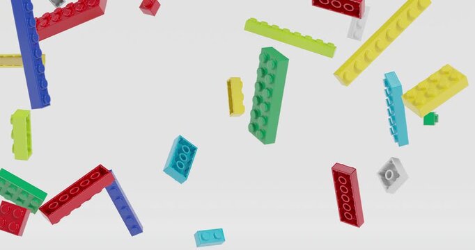 Toy plastic building bricks falling and rotating in slow motion footage with grey background. 3D 4K FX animation.
