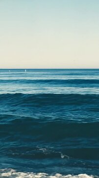 Serene Ocean Horizon Parallax, Calm Blue Water with Distant Bobbing Boats, Lateral Slide Camera Motion. Expansive Ocean Horizon Cinematic, Gentle Waves and Soft Diffused Daylight Video. Seascape
