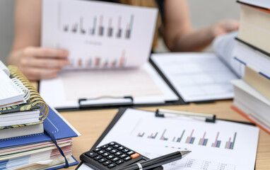 A businesswoman doing accounting in her company, tax settlements, a busy accountant