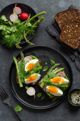 toast with dark rye bread asparagus and soft boiled egg