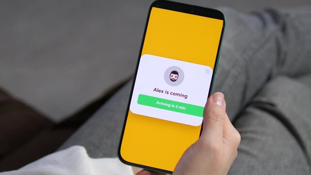 A detailed shot of a mobile application screen showing a drivers arrival alert. The clean interface with a driver icon and countdown timer highlights the reliability and safety of modern transport