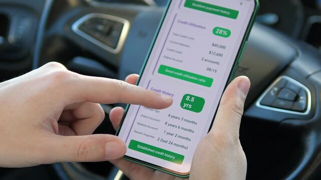 a man reviewing his financial health and credit history on a mobile device. High-quality footage highlighting credit utilization ratio and account mix. Perfect for modern lifestyle and wealth
