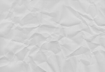 Obraz premium High-resolution white crumpled paper texture with soft folds and natural creases. Neutral background ideal for overlays, mockups, posters, packaging, editorial design, and minimalist compositions.