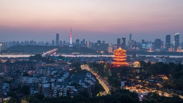 Wuhan China cityscape with Yellow Crane Tower and modern skyline at dusk