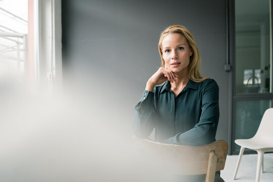 Portrait of successful, blond businesswoman