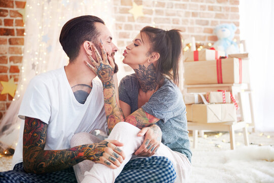 Happy young couple at home at Christmas time