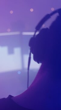 Gamer headbanging around while listening to music