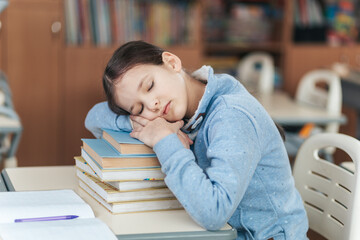 Student Finds Rest on a Stack of Books During a Busy School Day in a Lively Classroom Full of Learning Moments
