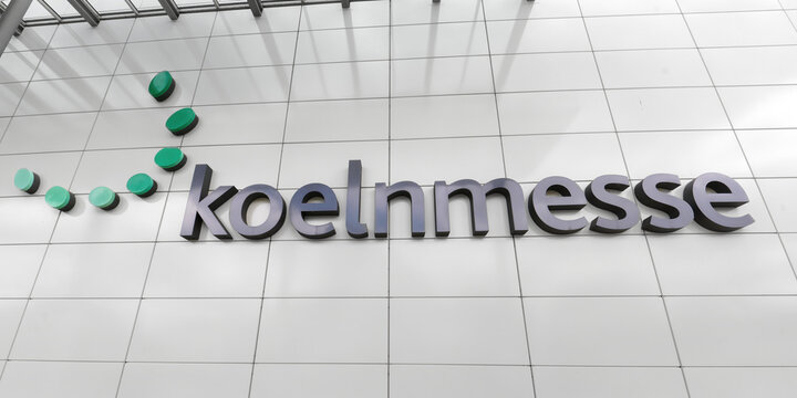 Cologne, Germany May 05 2025: Exterior view of the Koelnmesse trade fair logo on a white paneled facade in Cologne, Germany, representing the global trade fair industry