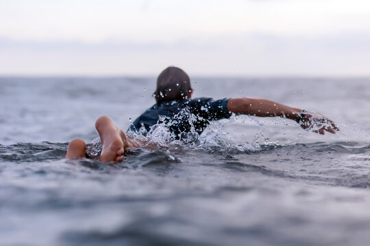 Back view of man on surfboard