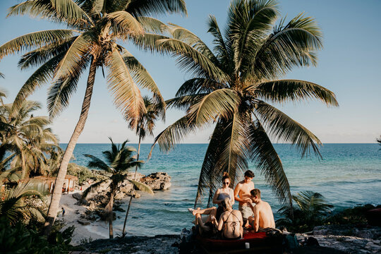 Mexico, Quintana Roo, Tulum, friends relaxing on the beach