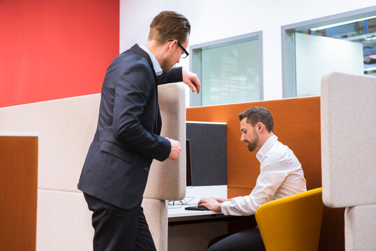 Two businessmen talking in office