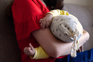 mother breastfeeding baby at home. motherhood and maternity care concept. Cheerful mom enjoy breastfeeding