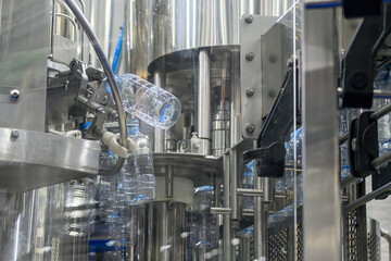 Drinking Water Mass Production Process on Overhead Conveyor Belt