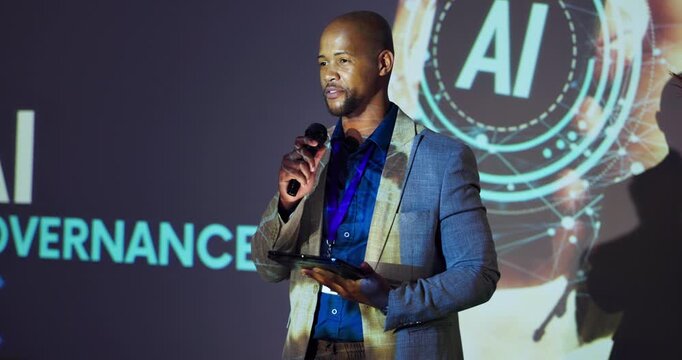 Tablet, man and business speaker in seminar for ai data governance, ethical guidelines and training conference. Professional, black person and talking with mic in international summit for compliance