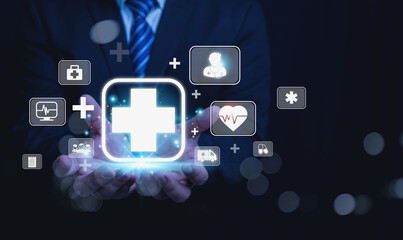 Fototapeta premium A Doctor holding a virtual interface featuring various healthcare icons.