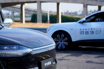 Obraz premium Chinese brand cars using Huawei's intelligent driving system are currently undergoing testing and trial drives.