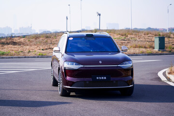 Obraz premium Chinese brand cars using Huawei's intelligent driving system are currently undergoing testing and trial drives.