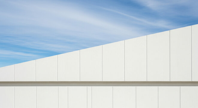 Minimalist Architecture: White Wall and Blue Sky Abstraction