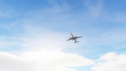 Fototapeta premium Airplane impressive landing flying overhead. Airplane flies in blue sky. Travel. Airplane takes off against the background of blue sky.