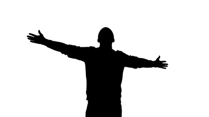 Silhouette of a man with arms outstretched in a gesture of freedom.