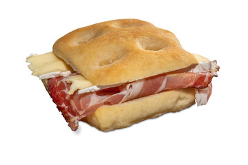 Sandwich made with focaccia bread filled with speck smoked ham and brie cheese, isolated