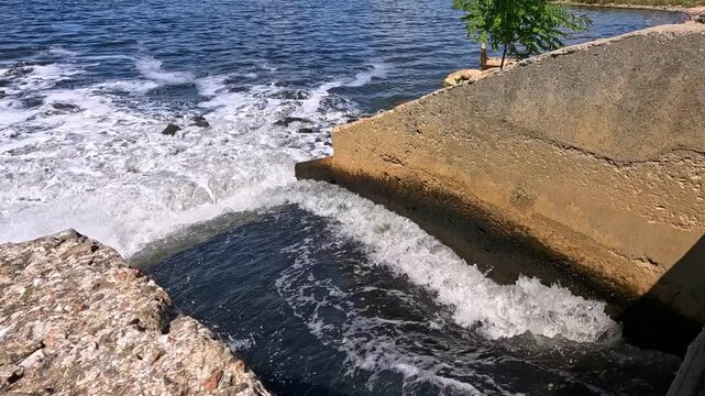 The Khadzhibey Estuary, Polluted water from a pipe from the "Irrigation Field" flows into the estuary