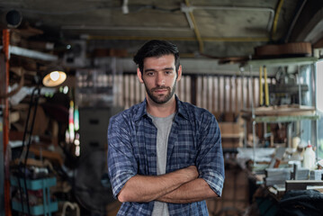Obraz premium Portrait of guitar luthier small business owner in workroom.